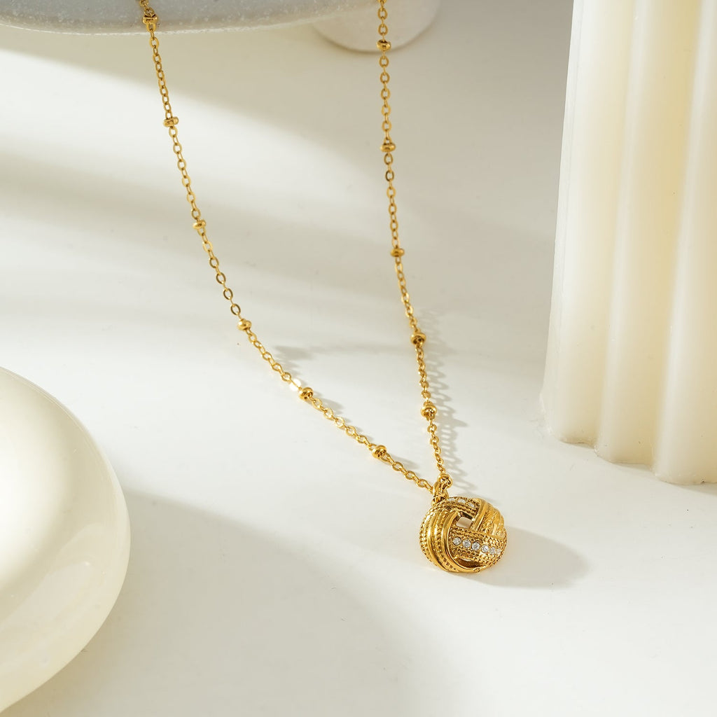 SALAMASINA Gold: Crystal Interwoven Knot Pendant Necklace