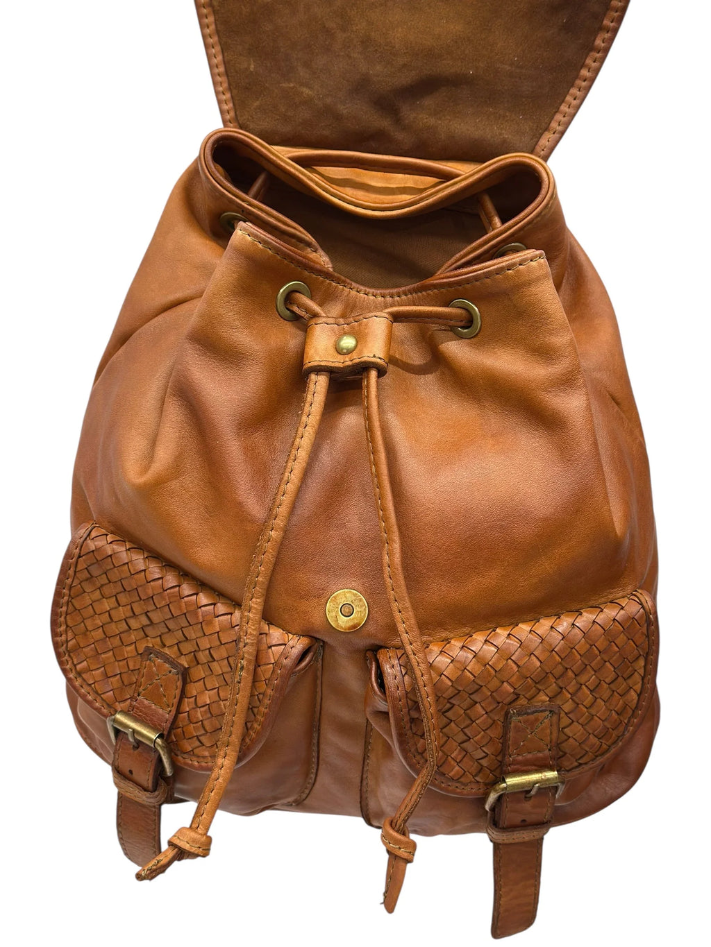 Basket-weave leather backpack with twin front pockets and buckle flap