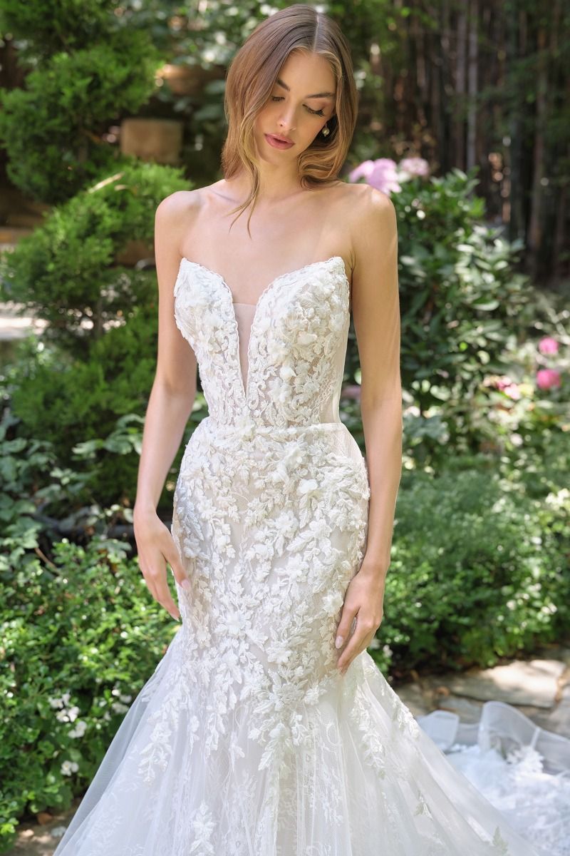 mermaid gown features a strapless lace-up closure for adjustable support